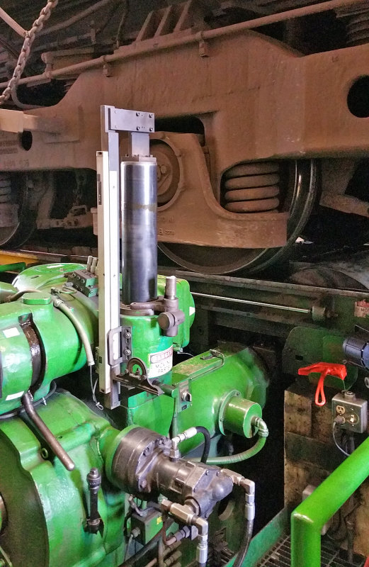 A CSX GE gets a wheel profiled by the Simmons Wheel Cutting Machine