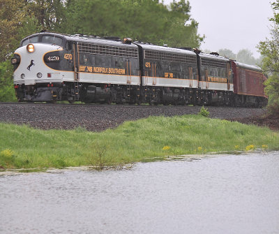Eastbound 956 passes Lake Wells during a hard downpour 