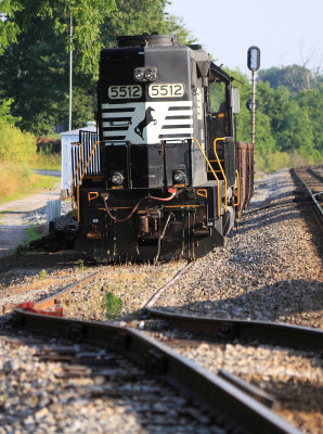 NS 5512 is tied down with a work train in the seldom used house track at Talmage. 