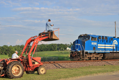 Emmett up in the bucket of a tractor, getting a high shot of the Conrail Heritage engine at Bondville 