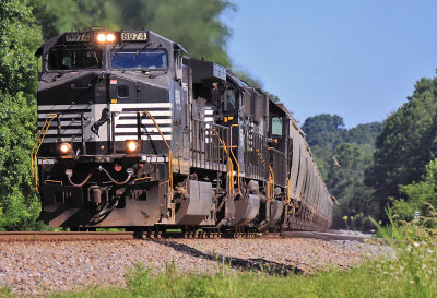 Loaded grain train 54A rolls across single track at Flat Rock on a cool summer morning. 