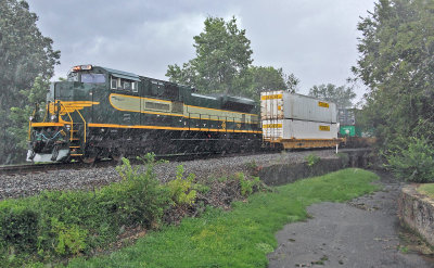 Erie 1068 shoves hard on the bottom of train 23G as they pass through Harrodsburg during an intense summer storm. 