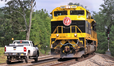 Virginian 1069 passes a track inspector at the East end of Tucker 