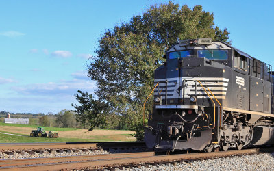 EMD and a John Deere...NS 168 sits at Palm waiting on a meet as a farmer heads for the barn after a long day in the hay. 