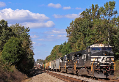 Southbound 117 comes through the roller coaster at Gradison under a Kodachrome sky 