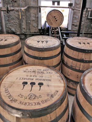 Brand new oak barrels, charred on the inside, stand ready to receive the next batch of bourbon