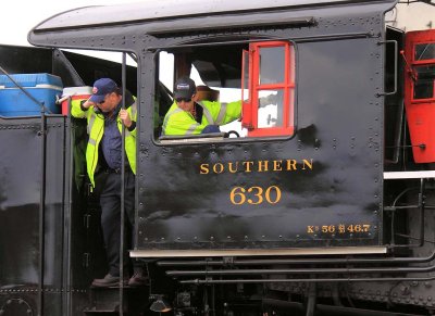 630's crew are all business as they back the train around the wye at Attalla