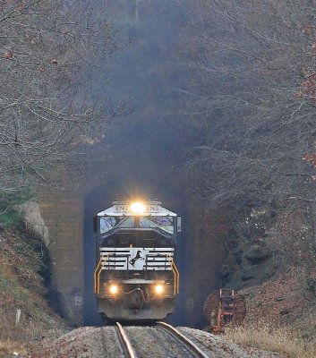 Smoke pours out of the portal as train 165 exits the West portal of Ridgecrest tunnel after climbing the loops 