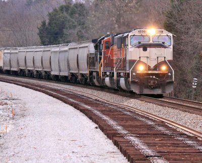 A Southbound grain train rolls across the soon to be double tracked construction area near CP Grove 