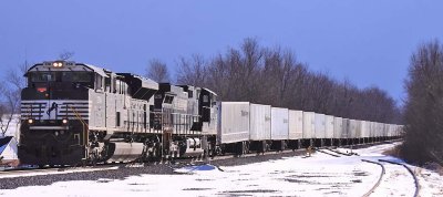 Triplecrown 264 heads North through Burgin with the dark clouds of a winter storm in the background 