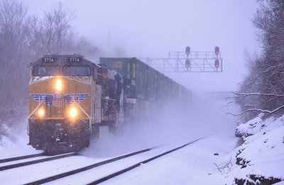 A UP GEVO leads NS 282 North through the heavy snow as the train leaves Danville 