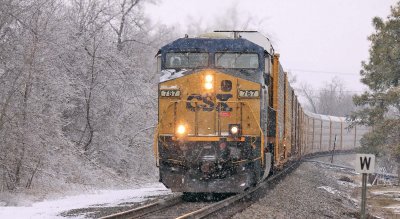 A lone CSX GE drags NS 197 through the ice and snow at Milidgeville