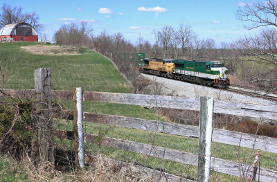 NS 215 passes the barn at Blanchet,  Ky on a fine Spring afternoon 