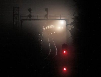NS 288 lights up the foggy searchligh signals at Kings Mountain before sunrise 
