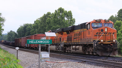 Southbound 167 with BNSF power passes the old depot at Helenwood 