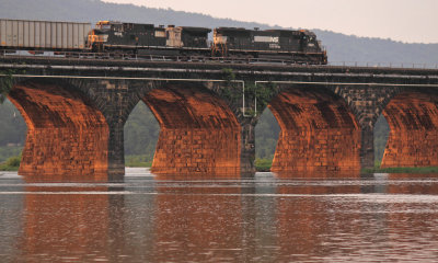 A Eastbound manifest crosses the Susquehanna River as the sun starts to set 