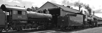 N&W 475 gets some attention outside the shop as #90 leaves town with the afternoon train 