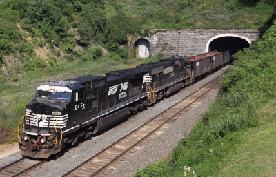 Late afternoon manifest pops out of the tunnel at Gallitzin 