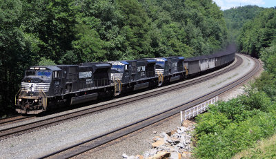A Trio of SD80Macs bring a loaded coal train down the mountain 