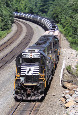 A SD60E helper set shoves on the bottom of a Eastbound oil train on the West Slope 