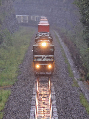 The Sound of a Trio of EMD's in #8 is all but drowned out by the rain as 223 climbs up Kings Mountain 