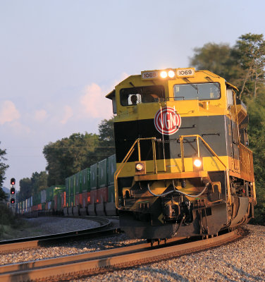The golden glow of a Kentucky sunset lights up NS 224 at Norwood on the CNO&TP