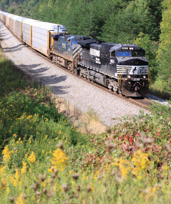 Northbound 27V with a BCRail GE 2nd out rolls down the hill at Parkers Lake 