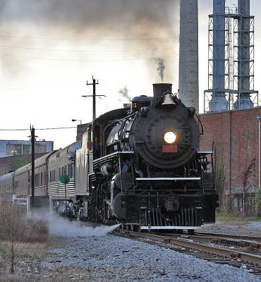 Somber lighting as 4501 passes through the industrial ruins at Rossville, Ga 