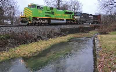Illinois Terminal 1072 leads NS 27V West along Town Branch creek at Harrodsburg, KY in the last light of a wet day. 