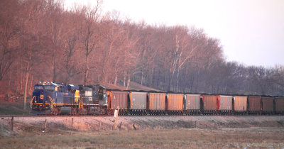 The setting sun chases N&W 8103 up the valley at Spring Lick 