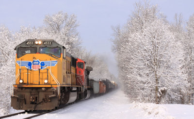 UP and CN power lead NS M67 through a frosty morning at Alton, KY 