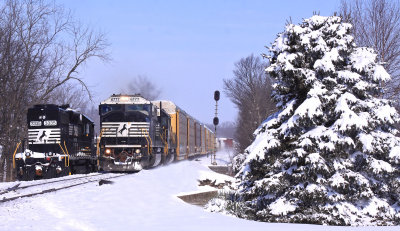 The day after a record 2 foot snowfall in Central KY, NS 167 passes a work train at Talmage 
