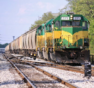 LIRC 2371 brings a grain train headed for the NS down the mainline at CP MARK in Louisville