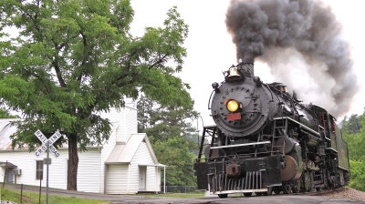  4501 dusted the tin roof of the Lick Creek Baptist Church with cinders  as she headed West to Bulls Gap 