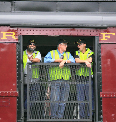 N&W 611 crew members enjoy the ride from the tool car 