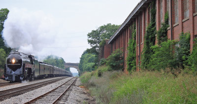 An old factory stands silent as 611 roars through Bedford 