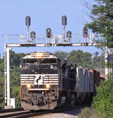 An Eastbound comes under the Southern signal bridge at Thomasville 