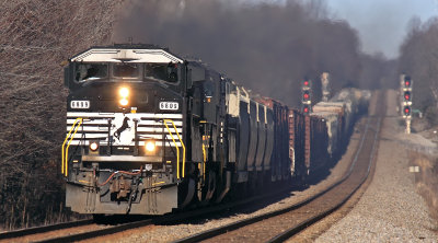 A former BN Three Window SD60m leads a southbound through the rollercoaster at Gradison 