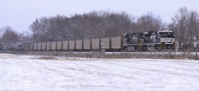 Eastbound 708 rolls through the snow covered fields at Vanarsdale 