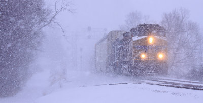 Heavy wind and snow pelt Eastbound 376 as it pulls out of the siding at East Talmage 
