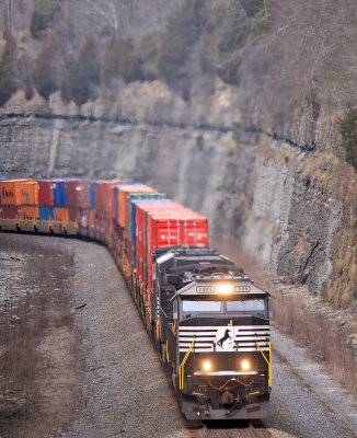 A newly rebuilt 7000 series SD60E leads NS 223 up the Mountain 