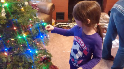 Christina hangs a Christmas Star