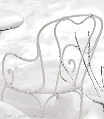 Romantic white chair in white snow..