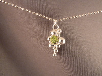 Peridot stone with sterling silver 'bubbles'. Stone is approx 4mm
