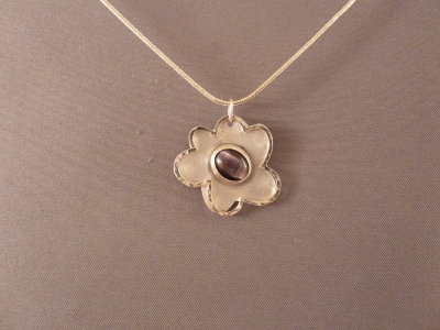 Floating flower pendant with purple 'goldstone'