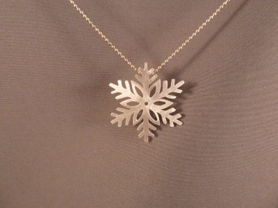Sterling snowflake - about the size of a loonie. Sold