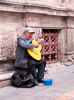 Blind Musician Playing Guitar on Street in Quito