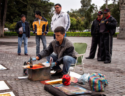 Street Artist Painting in Park in Quito