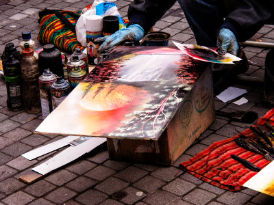 Street Artist Painting in Park in Quito