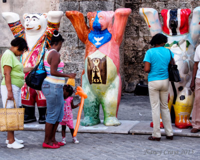 People Looking at Statues of United Buddy Bears (1185670)